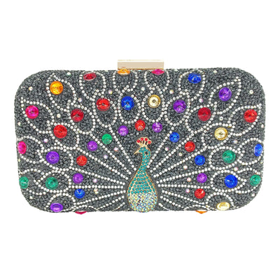Decorative clutch bag with peacock design and colorful gemstones on a white background