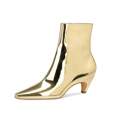 Gold metallic ankle boot on a white background